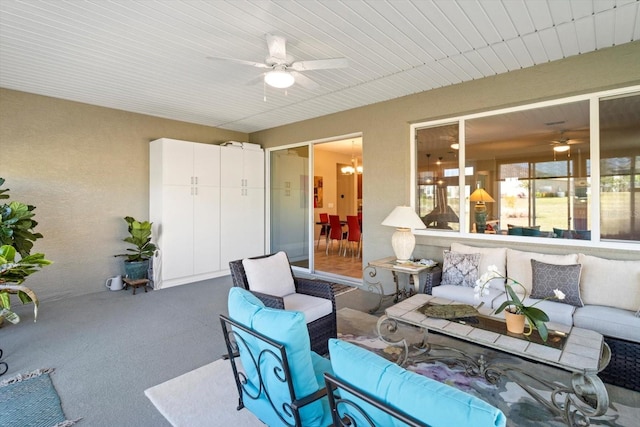 exterior space featuring an outdoor living space and ceiling fan