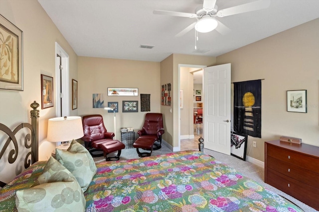 bedroom with baseboards, visible vents, ceiling fan, and carpet