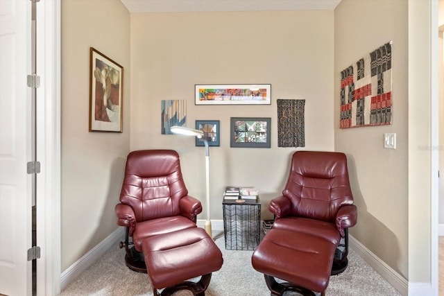 sitting room with carpet flooring and baseboards