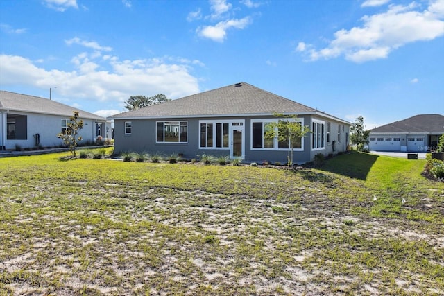 back of house with a yard
