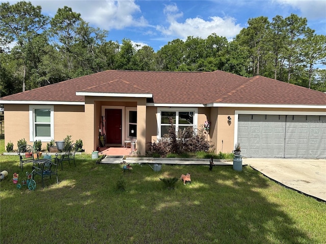 view of front of property with stucco siding, a front lawn, roof with shingles, and a garage