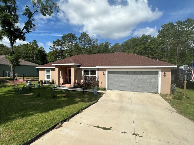 single story home with concrete driveway, a front lawn, and stucco siding