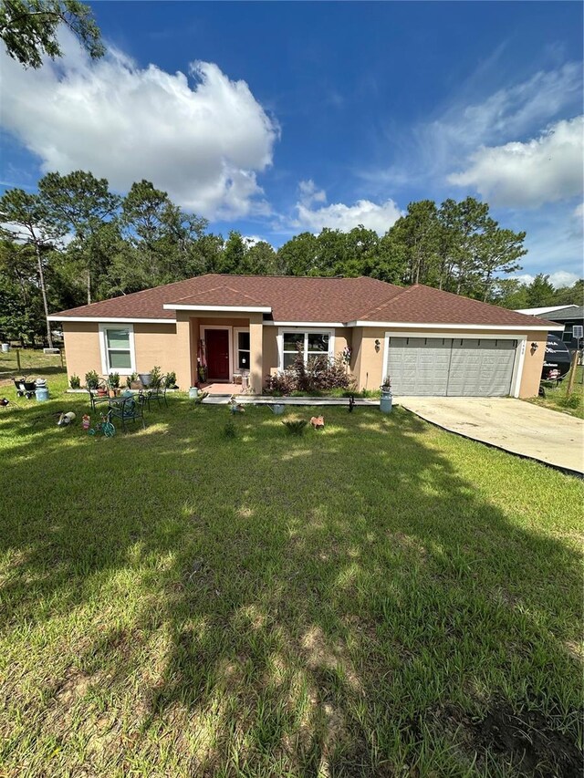 ranch-style home with an attached garage, driveway, a front lawn, and stucco siding