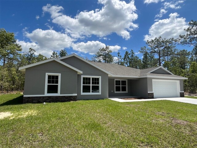 ranch-style house with stone siding, a garage, driveway, and a front lawn