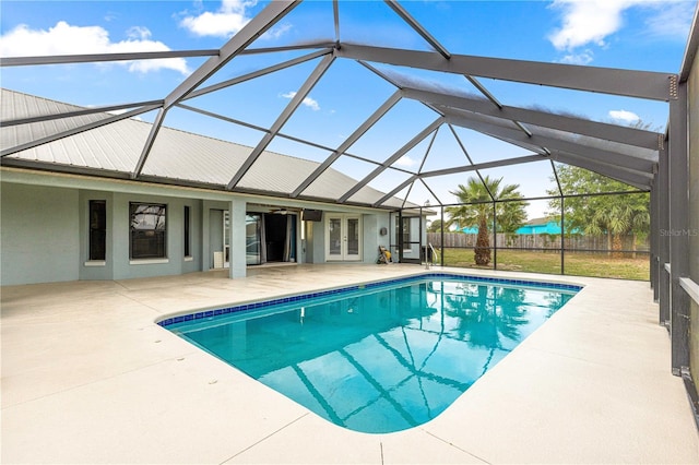 6045 SE 99th Pl, Belleview, FL 34420 - pool featuring french doors, fence, a patio, and glass enclosure