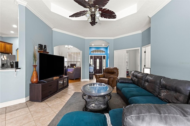 6045 SE 99th Pl, Belleview, FL 34420 - living area with a ceiling fan, baseboards, ornamental molding, and light tile patterned floors