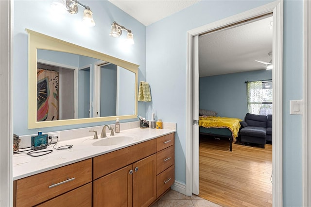 6045 SE 99th Pl, Belleview, FL 34420 - bathroom featuring vanity, ensuite bathroom, and wood finished floors