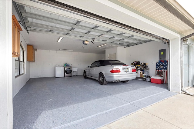 6045 SE 99th Pl, Belleview, FL 34420 - garage with a garage door opener, electric panel, and washing machine and clothes dryer