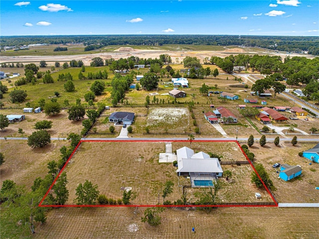 6045 SE 99th Pl, Belleview, FL 34420 - birds eye view of property with a rural view