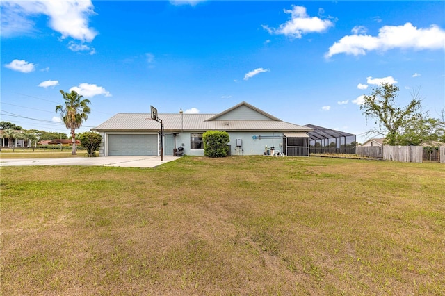 6045 SE 99th Pl, Belleview, FL 34420 - ranch-style home featuring metal roof, a front yard, fence, concrete driveway, and an attached garage