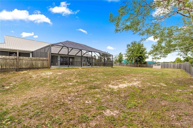 6045 SE 99th Pl, Belleview, FL 34420 - view of yard with a fenced backyard and glass enclosure