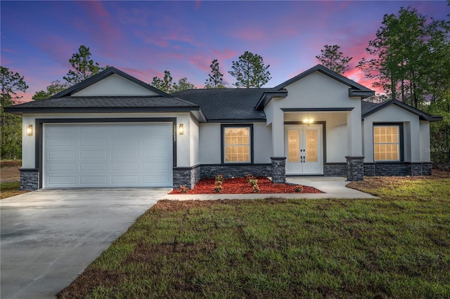 ranch-style home with french doors, stucco siding, driveway, and stone siding