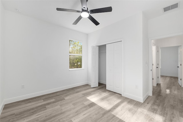 unfurnished bedroom with visible vents, baseboards, and light wood-type flooring