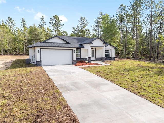 ranch-style house with central AC, driveway, stone siding, and stucco siding