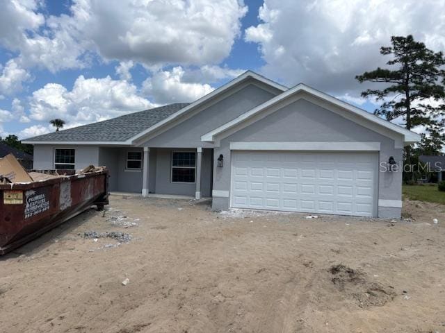ranch-style house with stucco siding and an attached garage