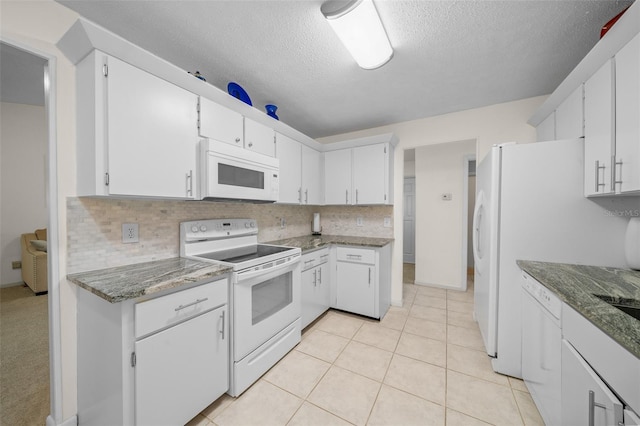 kitchen with white cabinetry, a textured ceiling, white appliances, and tasteful backsplash