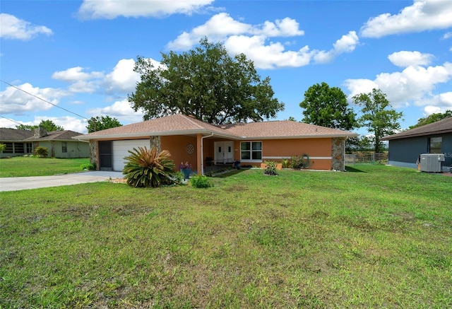 ranch-style home featuring a garage, stucco siding, concrete driveway, and a front yard