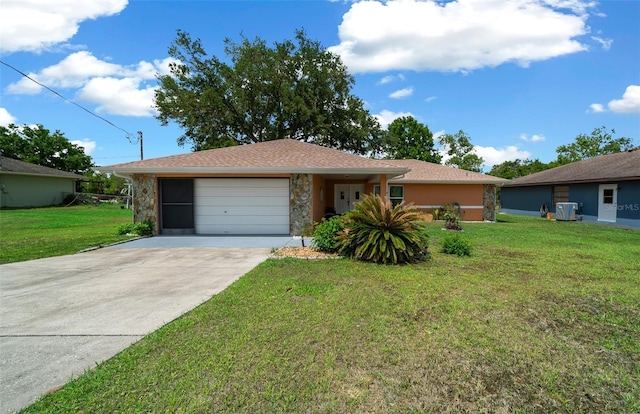 ranch-style house with a garage, stucco siding, driveway, and a front yard