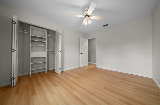 unfurnished bedroom featuring visible vents, light wood finished floors, ceiling fan, and baseboards