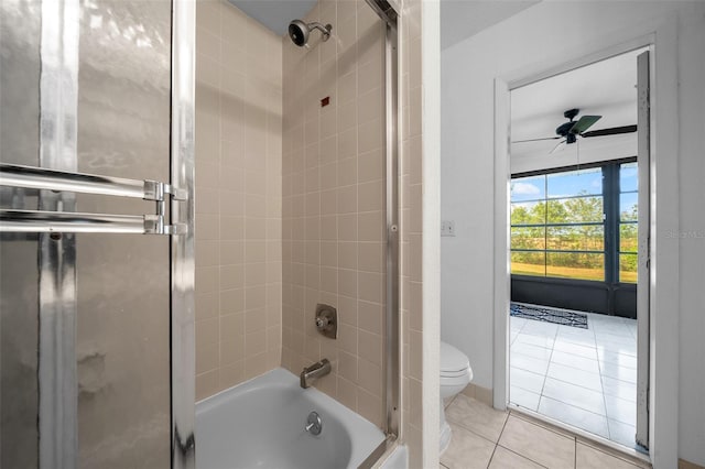 full bath with a ceiling fan, enclosed tub / shower combo, tile patterned floors, and toilet