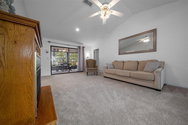 carpeted living area with a ceiling fan, visible vents, and lofted ceiling