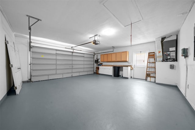 garage with baseboards and a garage door opener