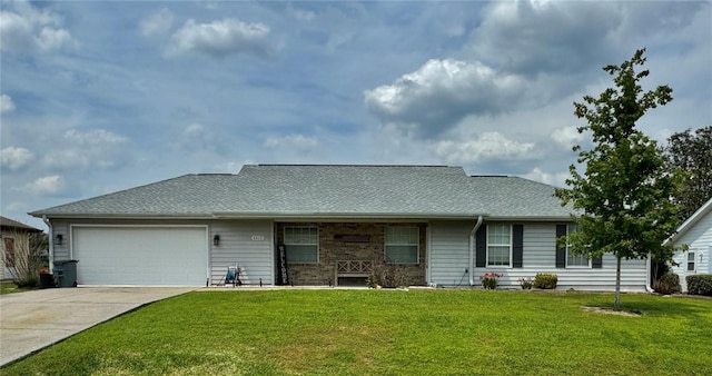 ranch-style house featuring an attached garage, driveway, and a front lawn
