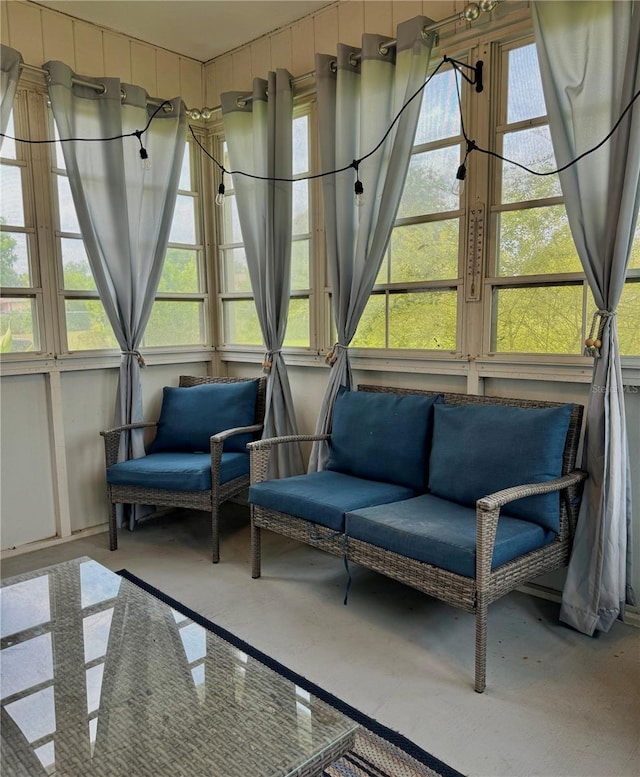 sunroom with outdoor lounge area and french doors
