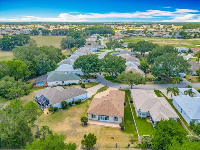 birds eye view of property with a residential view