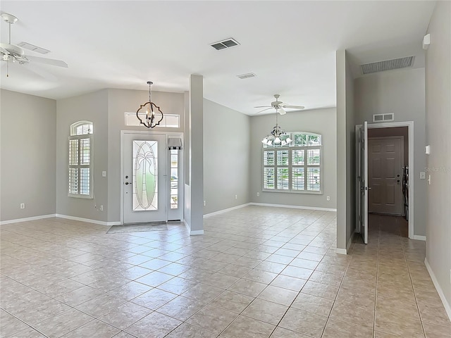 foyer entrance featuring visible vents and ceiling fan with notable chandelier