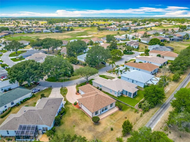 birds eye view of property featuring view of golf course and a residential view