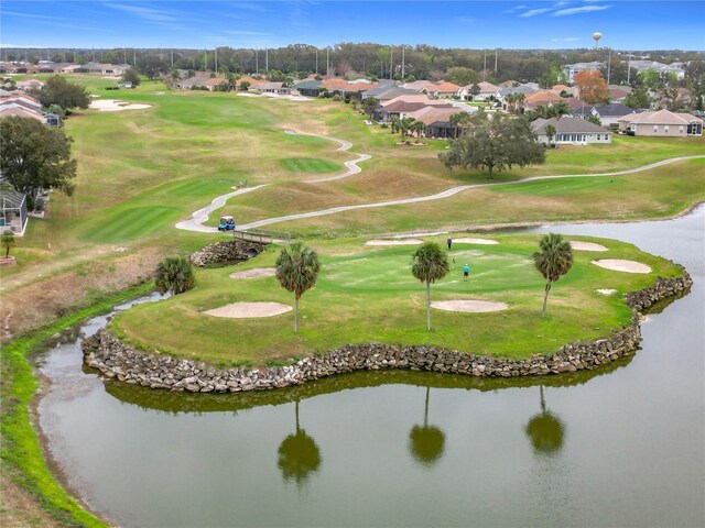 view of property's community featuring a water view, a residential view, and golf course view