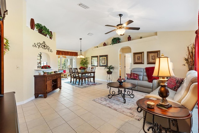 12147 SE 173rd Pl, Summerfield, FL 34491 - living area with arched walkways, a ceiling fan, light tile patterned floors, and baseboards