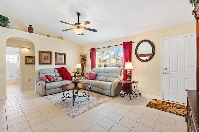 12147 SE 173rd Pl, Summerfield, FL 34491 - living room featuring ceiling fan, arched walkways, plenty of natural light, light tile patterned floors, and lofted ceiling
