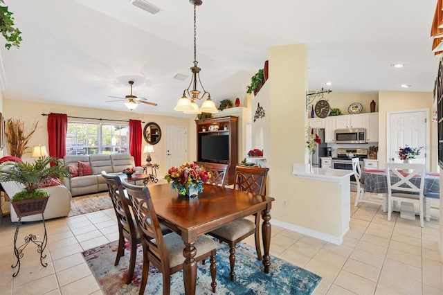 12147 SE 173rd Pl, Summerfield, FL 34491 - dining area with ceiling fan, visible vents, light tile patterned floors, and lofted ceiling