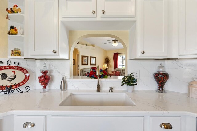 12147 SE 173rd Pl, Summerfield, FL 34491 - kitchen featuring a sink, ceiling fan, open shelves, and backsplash