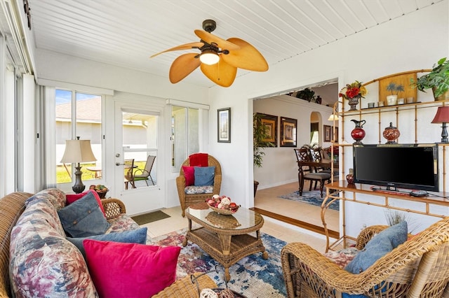 12147 SE 173rd Pl, Summerfield, FL 34491 - living room featuring a ceiling fan, arched walkways, tile patterned flooring, wooden ceiling, and baseboards
