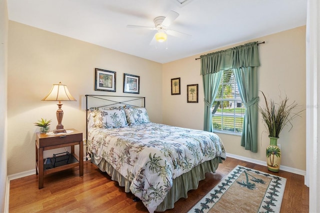 12147 SE 173rd Pl, Summerfield, FL 34491 - bedroom with a ceiling fan, baseboards, and wood finished floors