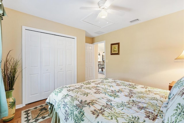 12147 SE 173rd Pl, Summerfield, FL 34491 - bedroom with ceiling fan, visible vents, wood finished floors, baseboards, and a closet
