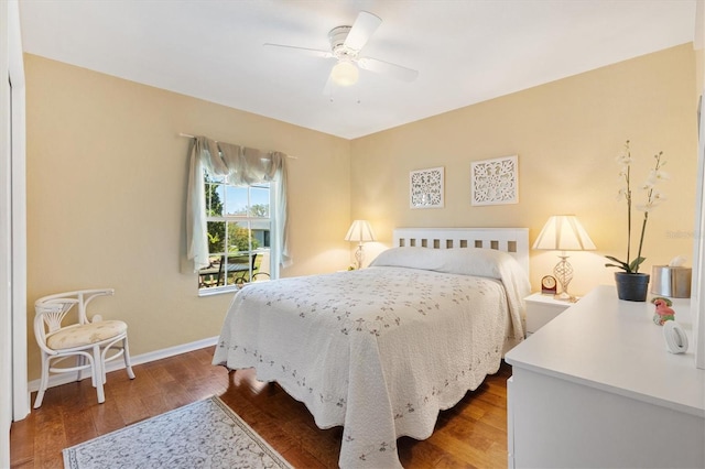 12147 SE 173rd Pl, Summerfield, FL 34491 - bedroom with baseboards, a ceiling fan, and wood finished floors