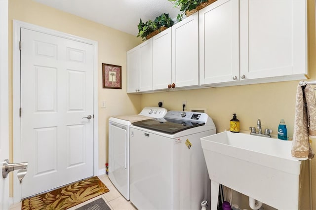 12147 SE 173rd Pl, Summerfield, FL 34491 - laundry area with cabinet space, separate washer and dryer, light tile patterned floors, and a sink