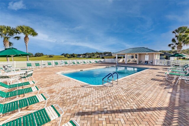 12147 SE 173rd Pl, Summerfield, FL 34491 - community pool featuring a patio and fence