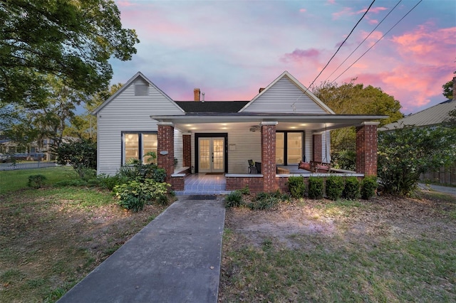 716 SE Wenona Ave, Ocala, FL 34471 - view of front of property with a porch, french doors, and brick siding