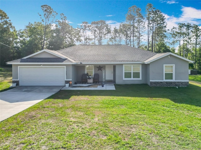 9525 SW 200th Ct, Dunnellon, FL 34431 - single story home with a front yard, a garage, concrete driveway, a shingled roof, and stucco siding