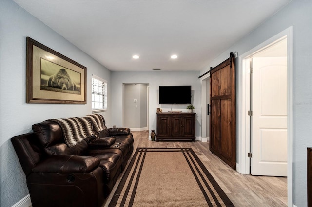 3250 SW 46th Ave, Ocala, FL 34474 - living area with visible vents, a barn door, baseboards, light wood-style floors, and recessed lighting