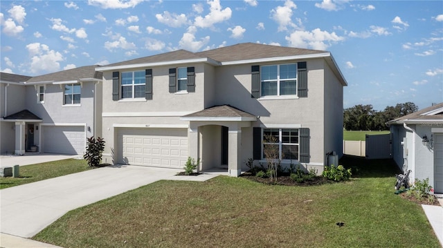 view of front of house featuring a garage, fence, a front lawn, concrete driveway, and stucco siding
