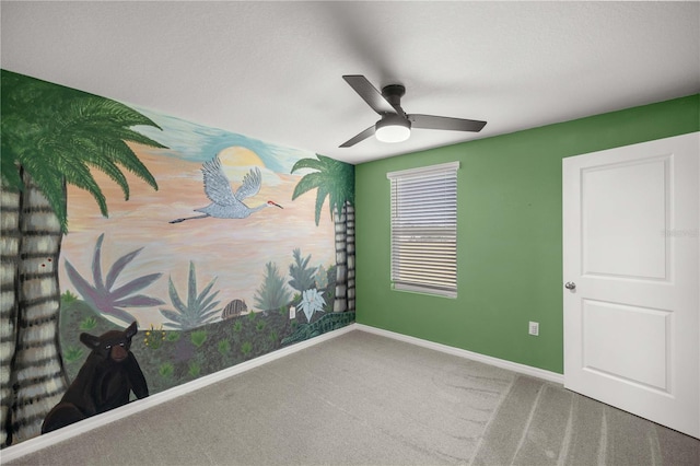 unfurnished bedroom with carpet floors, baseboards, and ceiling fan