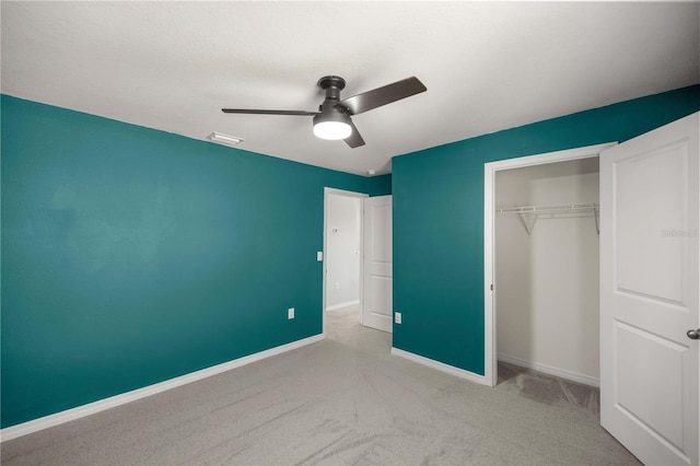 unfurnished bedroom with a ceiling fan, visible vents, baseboards, a closet, and carpet flooring