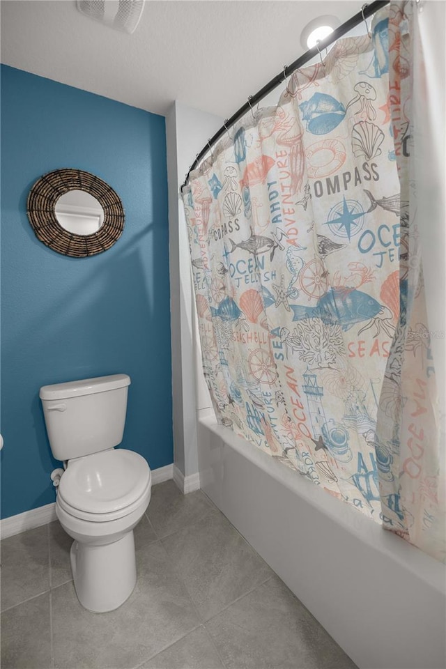 full bathroom with visible vents, tile patterned flooring, shower / bath combo, baseboards, and toilet