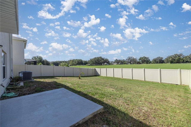 view of yard with central AC, a fenced backyard, and a patio area